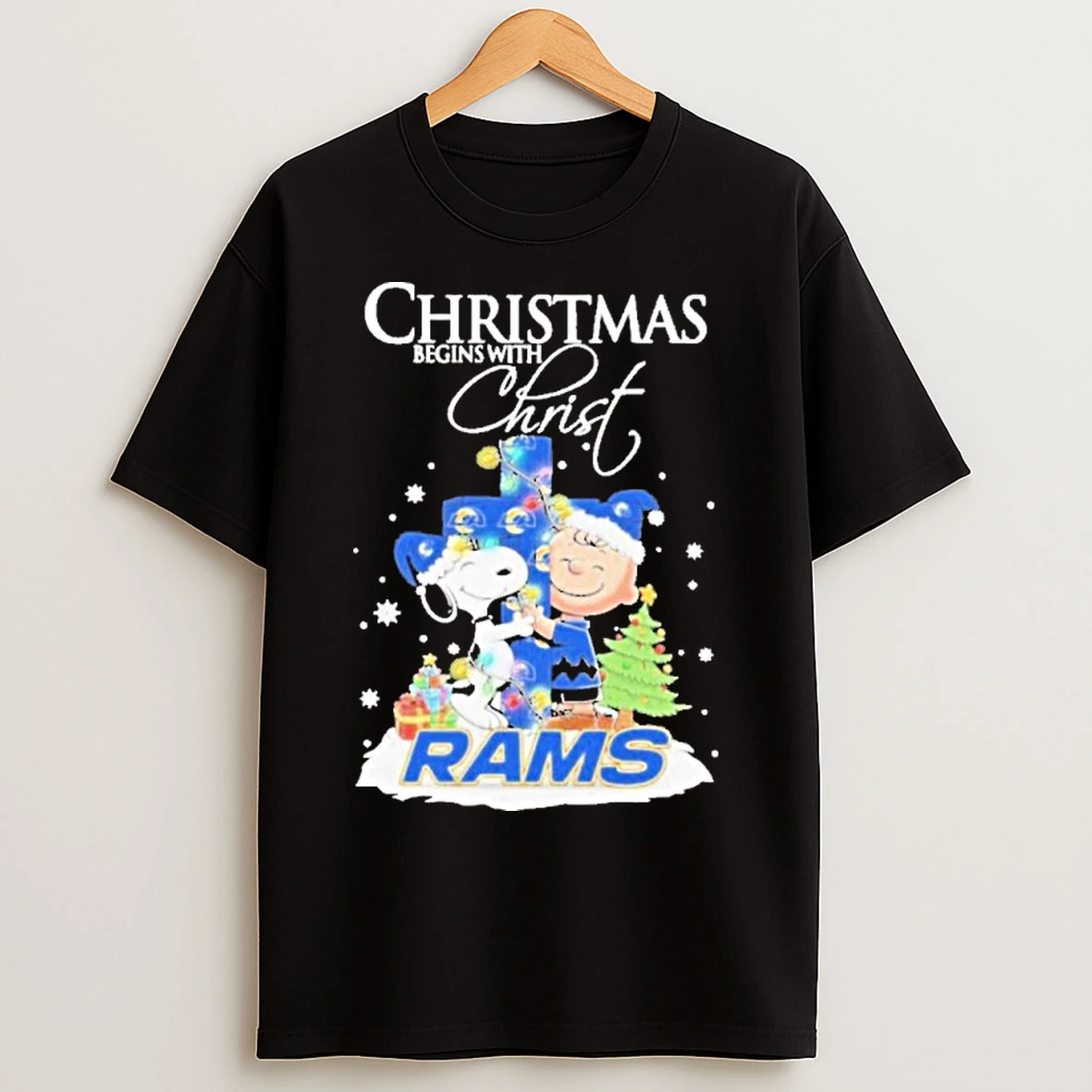 Classic 2025 Snoopy And Charlie Brown The Peanuts X Los Angeles Rams Merry Christmas Begins With Christ T Shirts