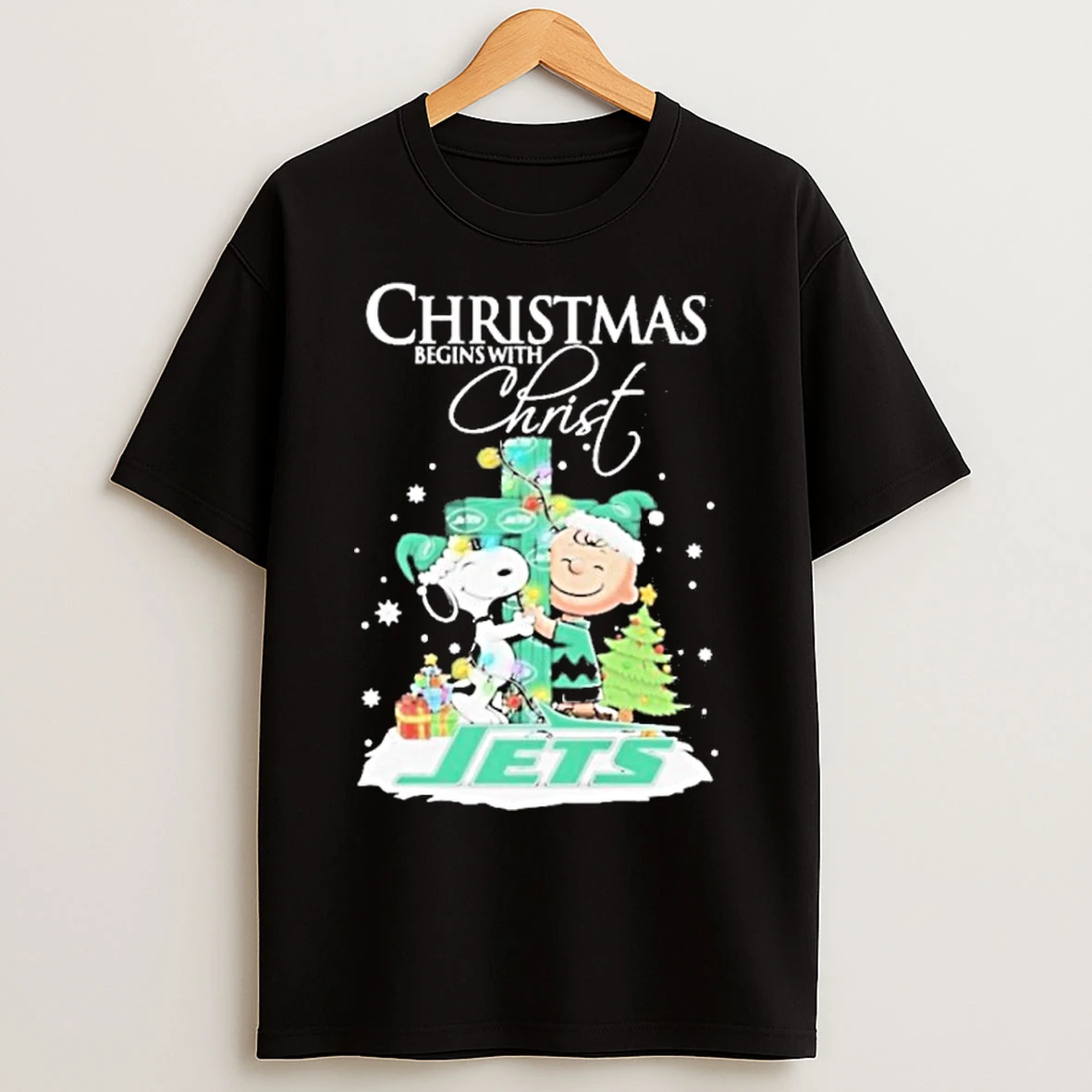 Classic 2025 Snoopy And Charlie Brown The Peanuts X New York Jets Merry Christmas Begins With Christ T Shirts