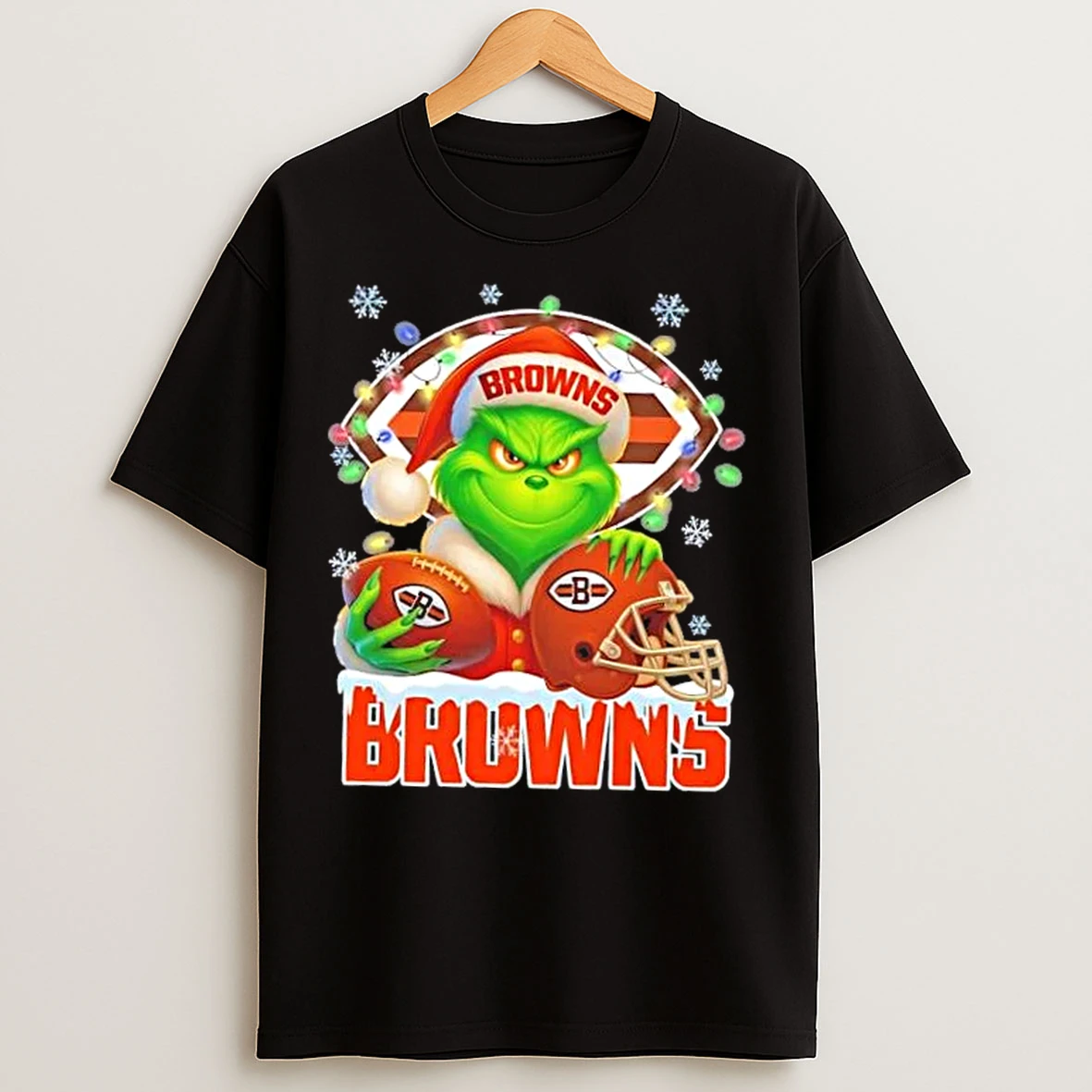 Classic Grinch Christmas Lights Holding A Ball And Smiling At Cleveland Browns Fans T Shirts