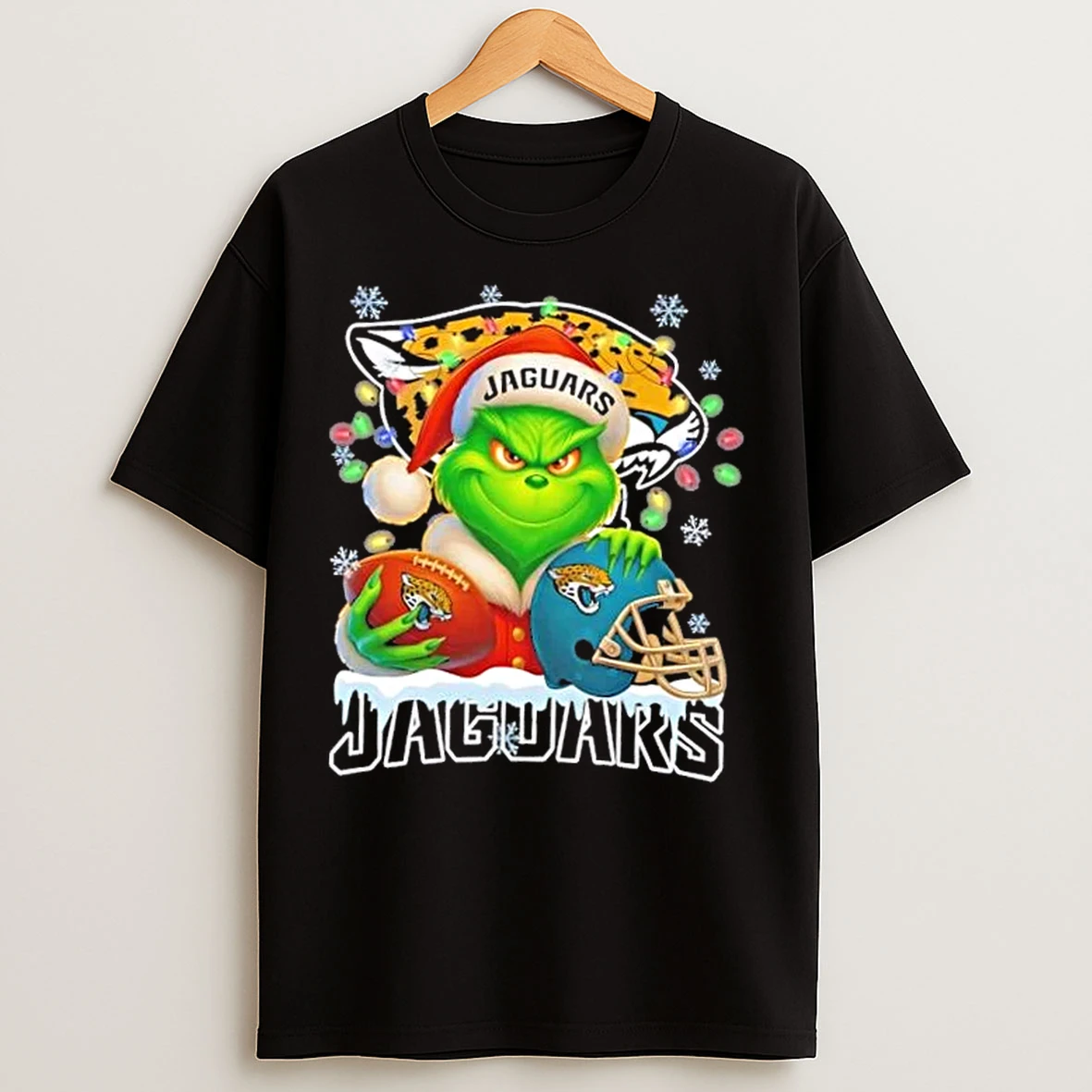 Classic Grinch Christmas Lights Holding A Ball And Smiling At Jacksonville Jaguars Fans T Shirts