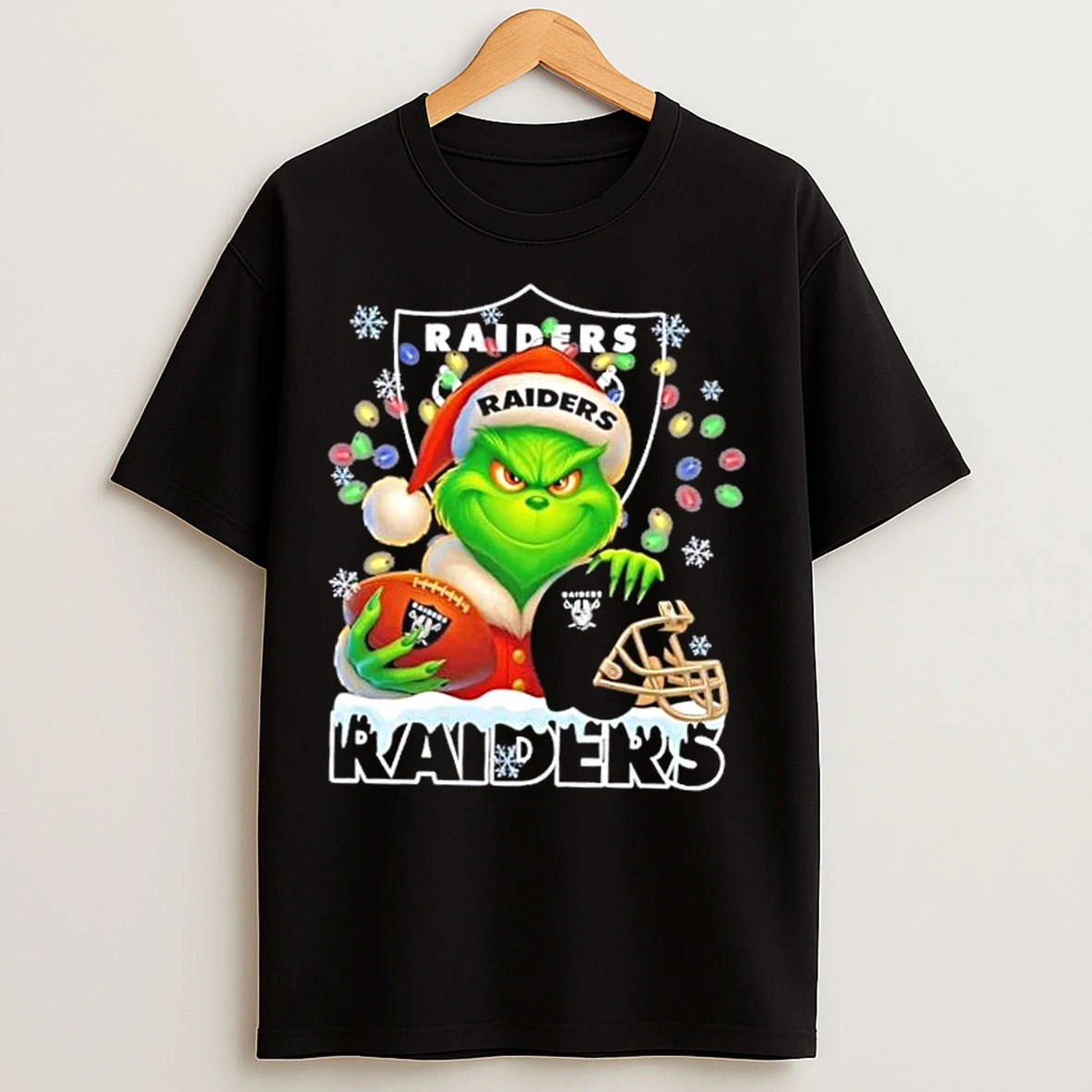 Classic Grinch Christmas Lights Holding A Ball And Smiling At Las Vegas Raiders Fans T Shirts