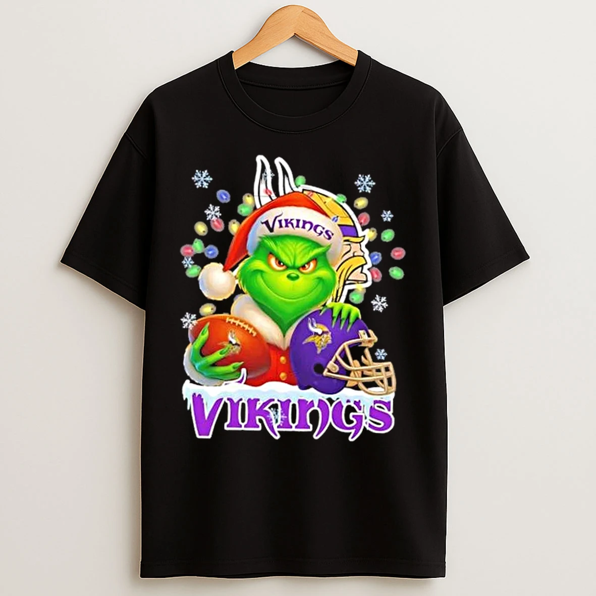 Classic Grinch Christmas Lights Holding A Ball And Smiling At Minnesota Vikings Fans T Shirts