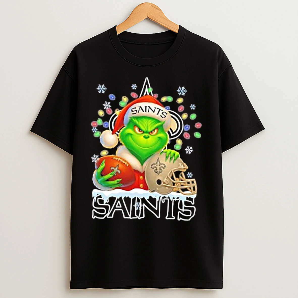 Classic Grinch Christmas Lights Holding A Ball And Smiling At New Orleans Saints Fans T Shirts