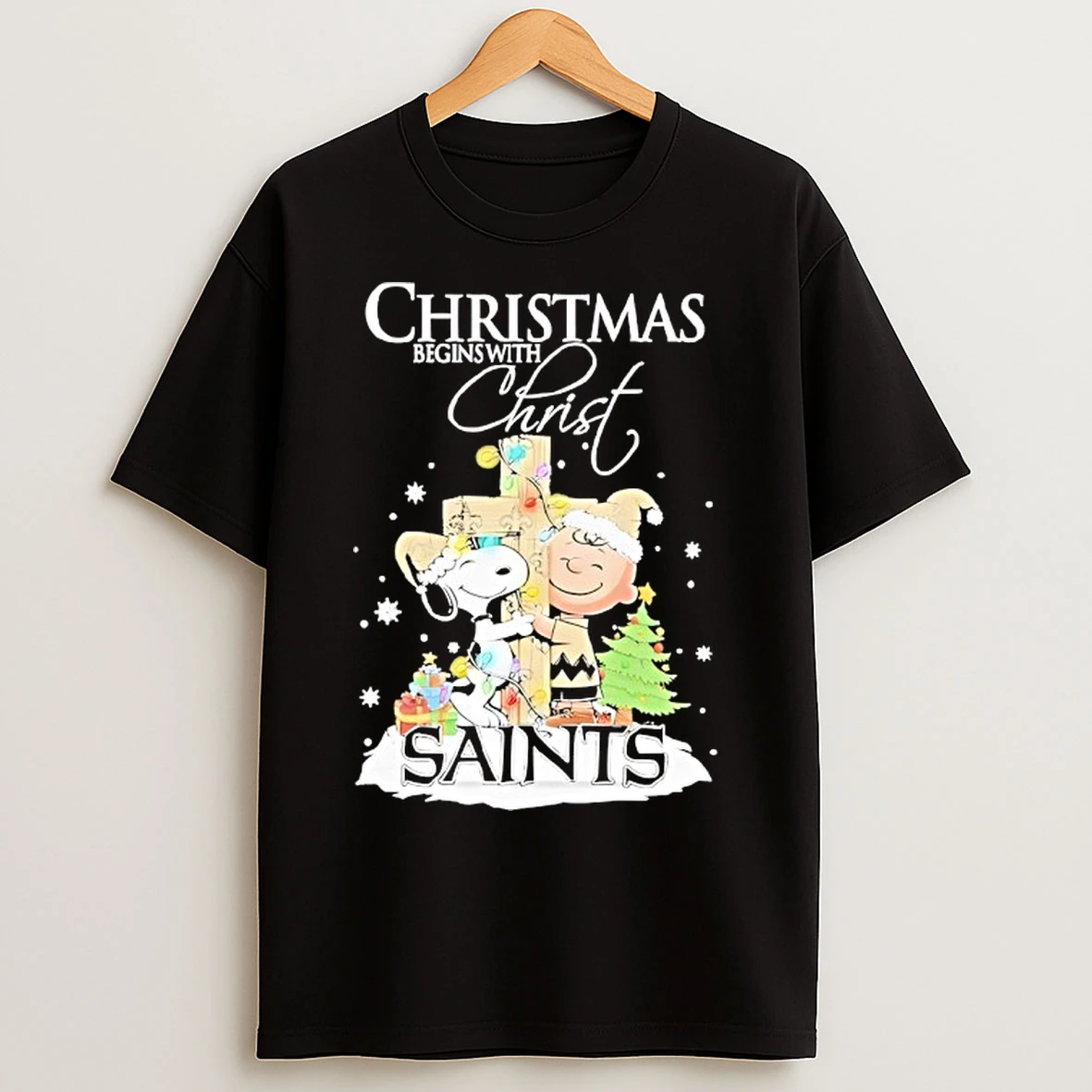 Classic Snoopy And Charlie Brown The Peanuts X New Orleans Saints Merry Christmas Begins With Christ T Shirts
