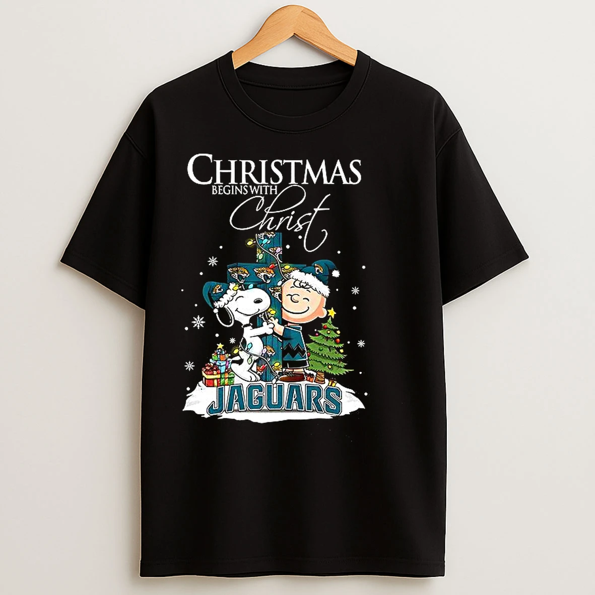 Classic Snoopy And Charlie Brown X Jacksonville Jaguars Christmas Begins With Christ Cross T Shirts