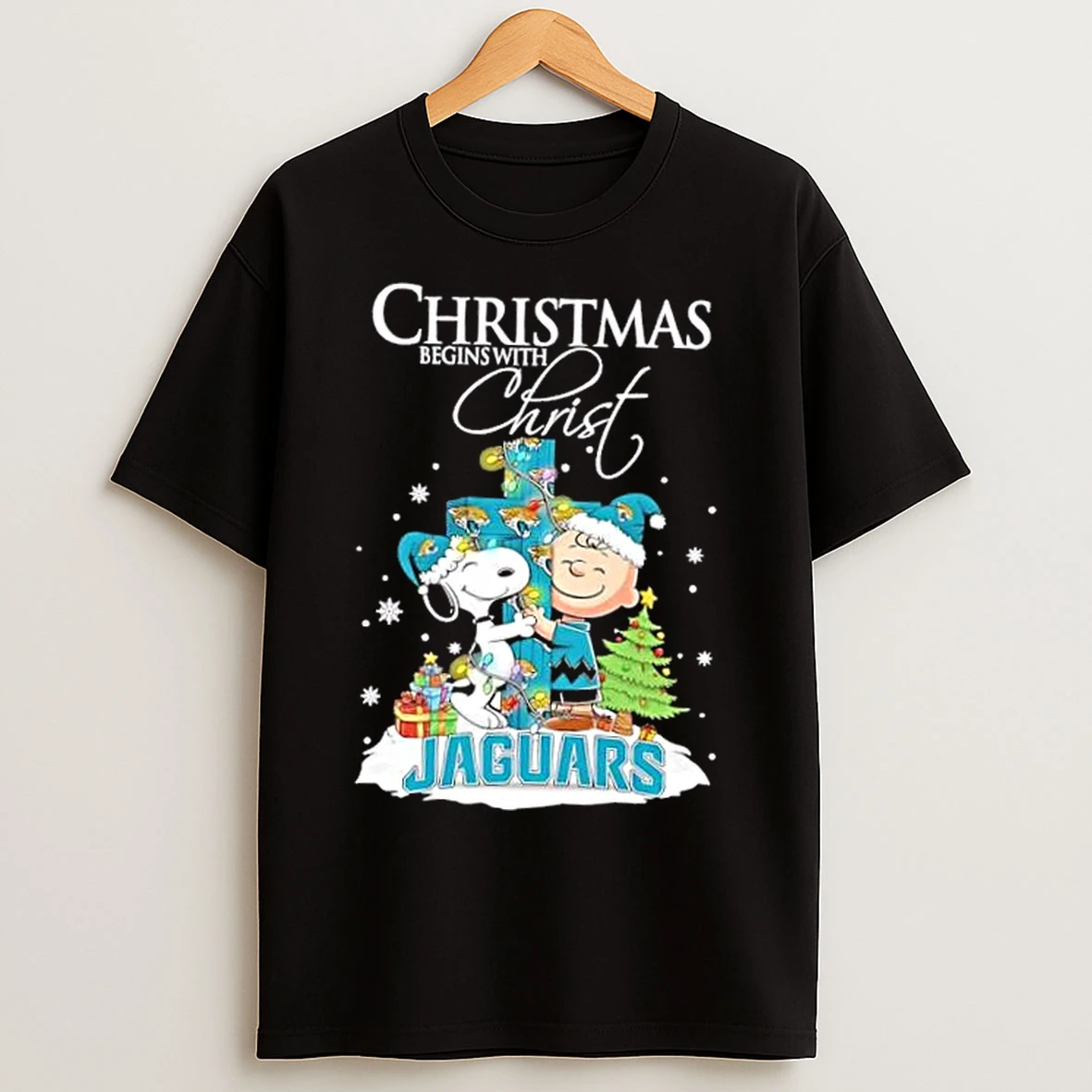 Classic Snoopy And Charlie Brown X Jacksonville Jaguars Christmas Begins With Christ T Shirts