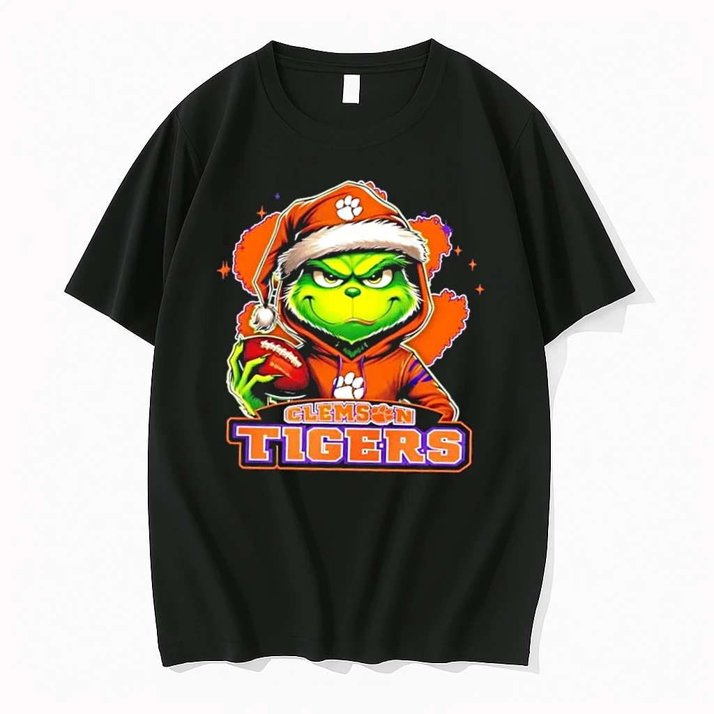 Grinch Is Holding A Ball And Smiling At Clemson Tigers Fans Christmas Shirts