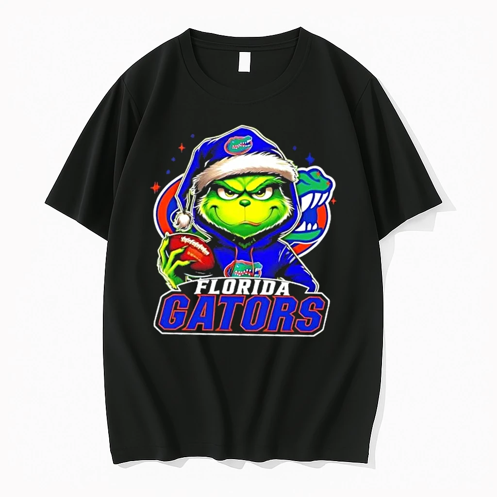 Grinch Is Holding A Ball And Smiling At Florida Gators Fans Christmas Shirts