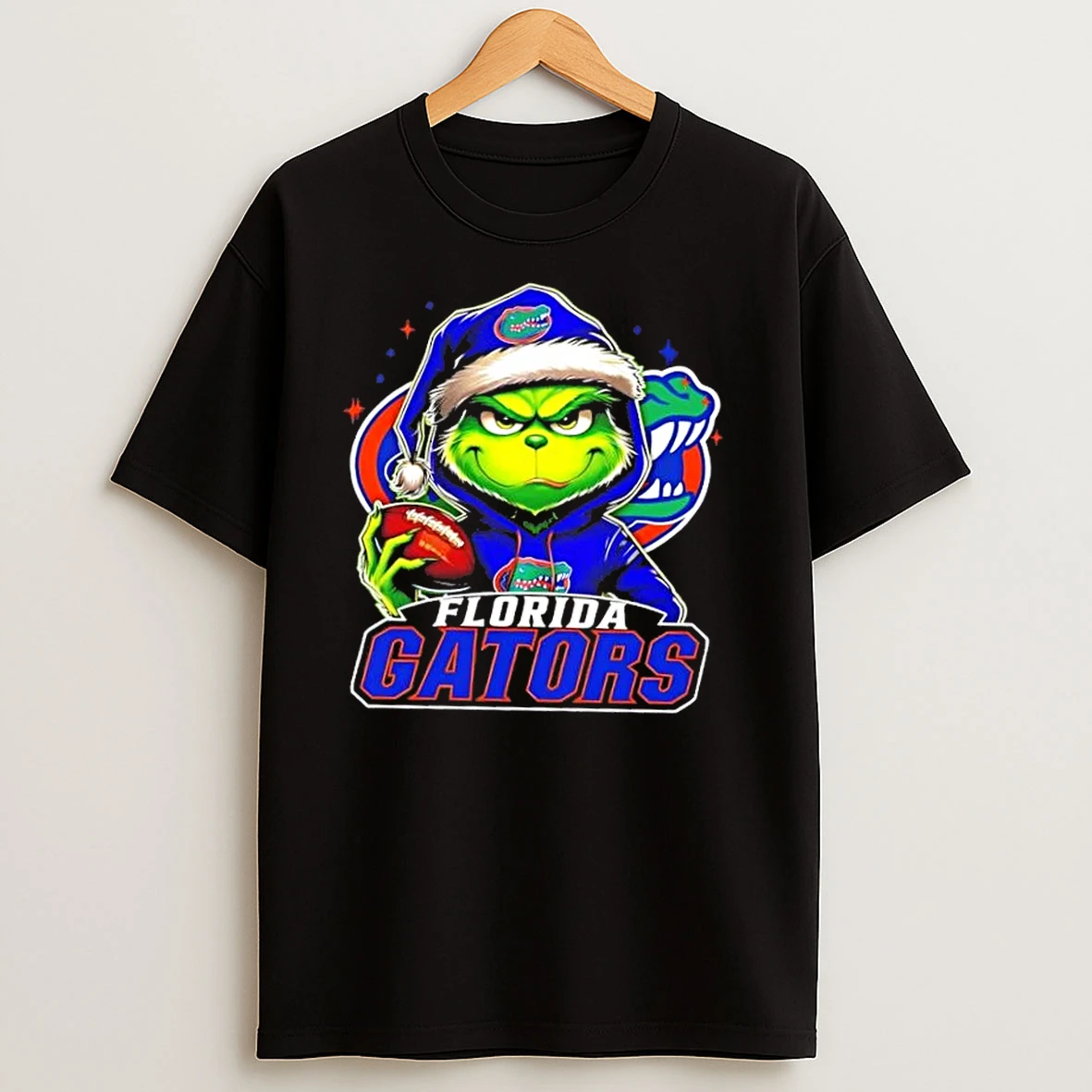 Grinch Is Holding A Ball And Smiling At Florida Gators Fans Christmas T Shirts