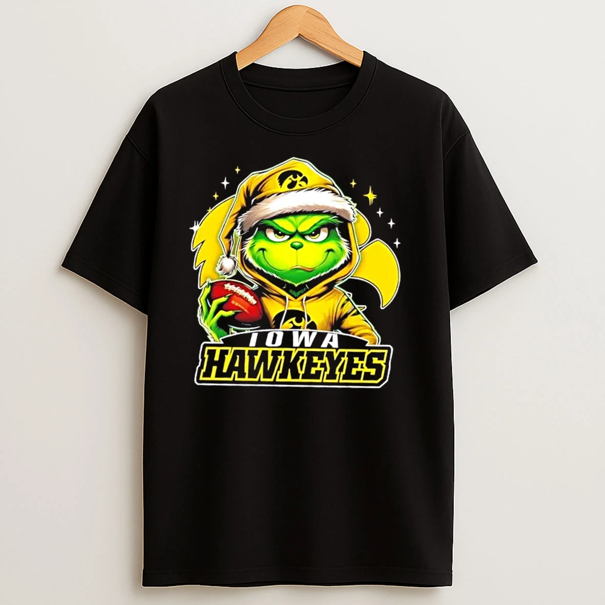 Grinch Is Holding A Ball And Smiling At Iowa Hawkeyes Fans Christmas T Shirts