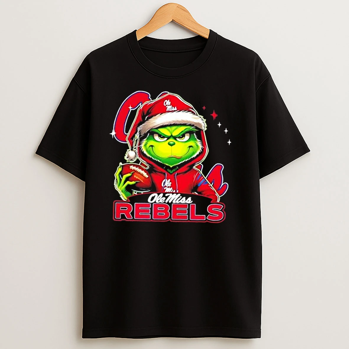 Grinch Is Holding A Ball And Smiling At Ole Miss Rebels Fans Christmas T Shirts