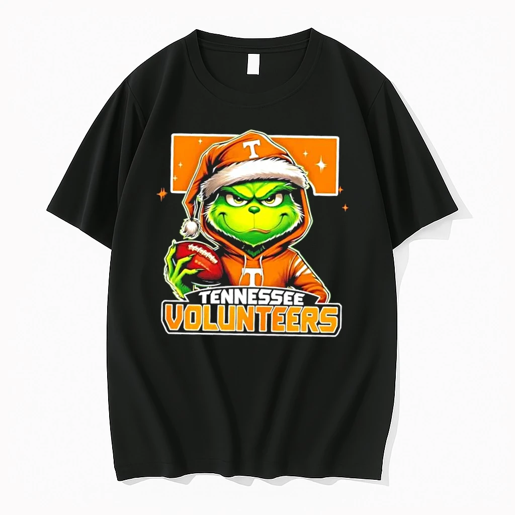 Grinch Is Holding A Ball And Smiling At Tennessee Volunteers Fans Christmas Shirts