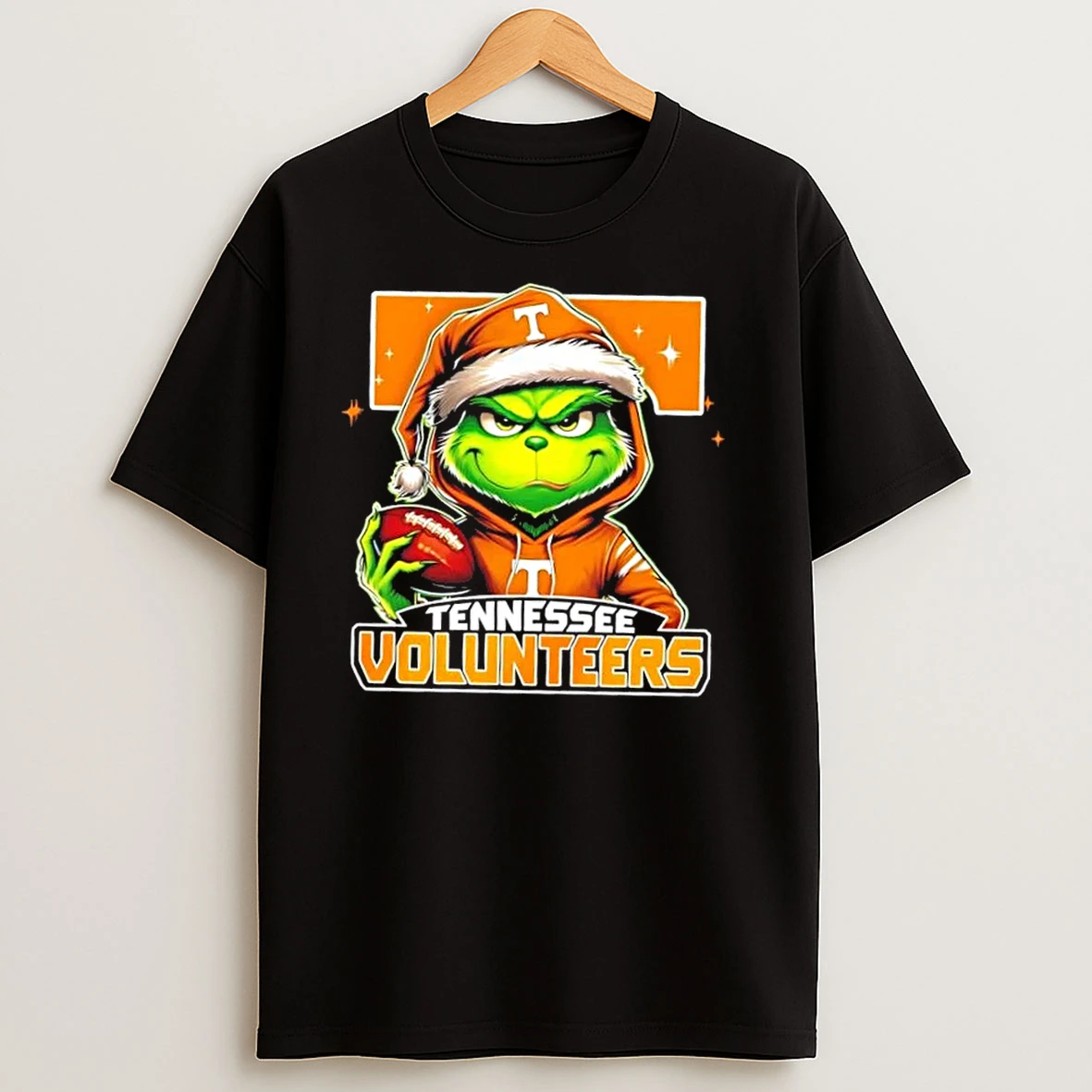 Grinch Is Holding A Ball And Smiling At Tennessee Volunteers Fans Christmas T Shirts