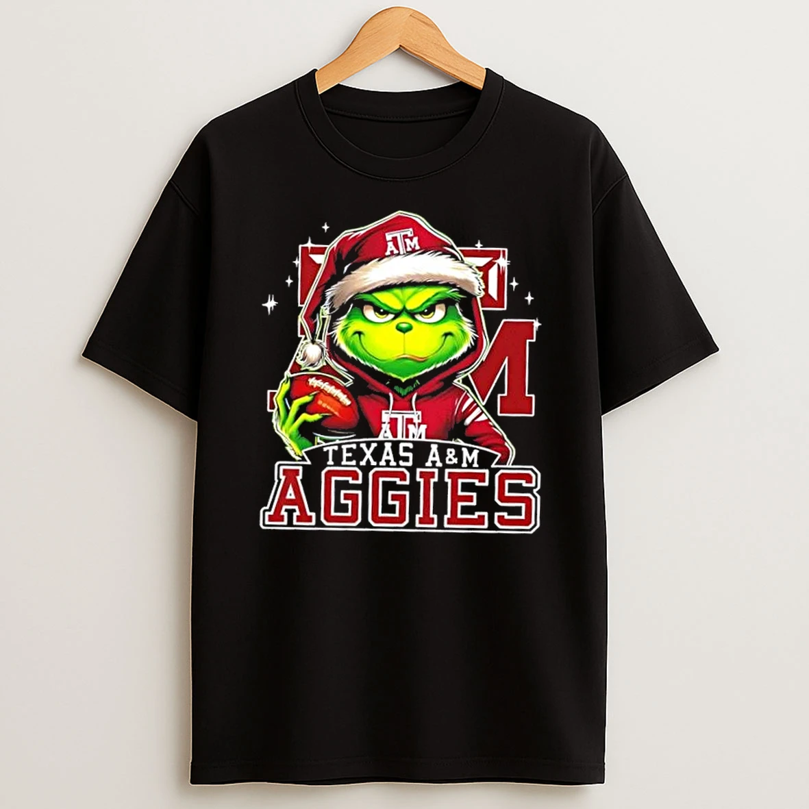 Grinch Is Holding A Ball And Smiling At Texas Am Aggies Fans Christmas Shirts