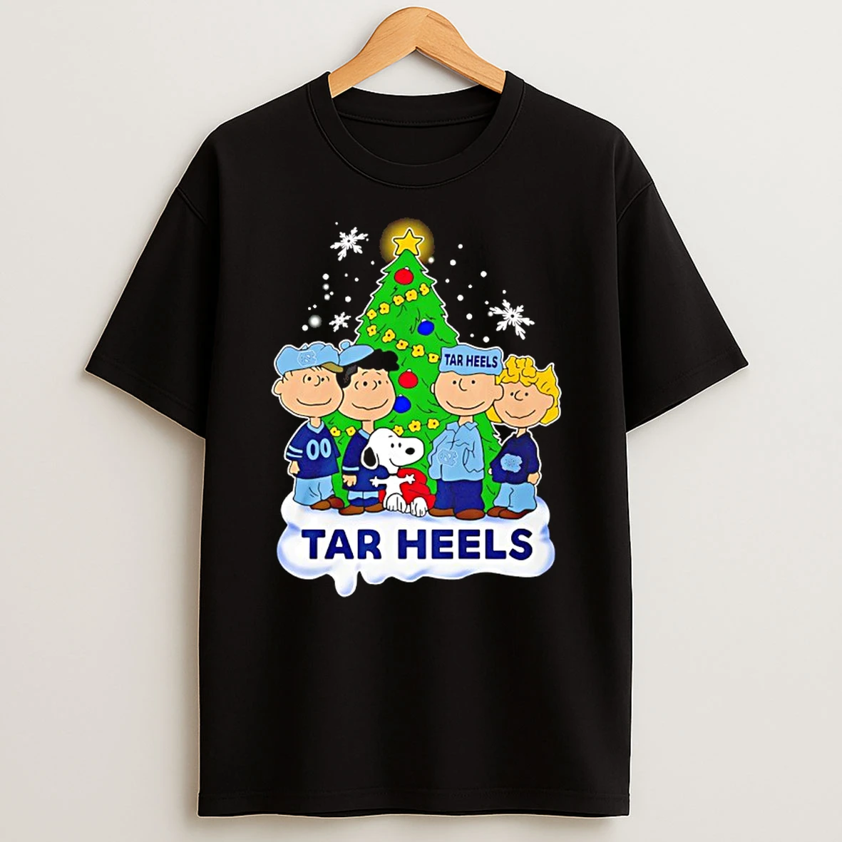 North Carolina Tar Heels Snoopy And The Peanuts Christmas 2025 Shirts