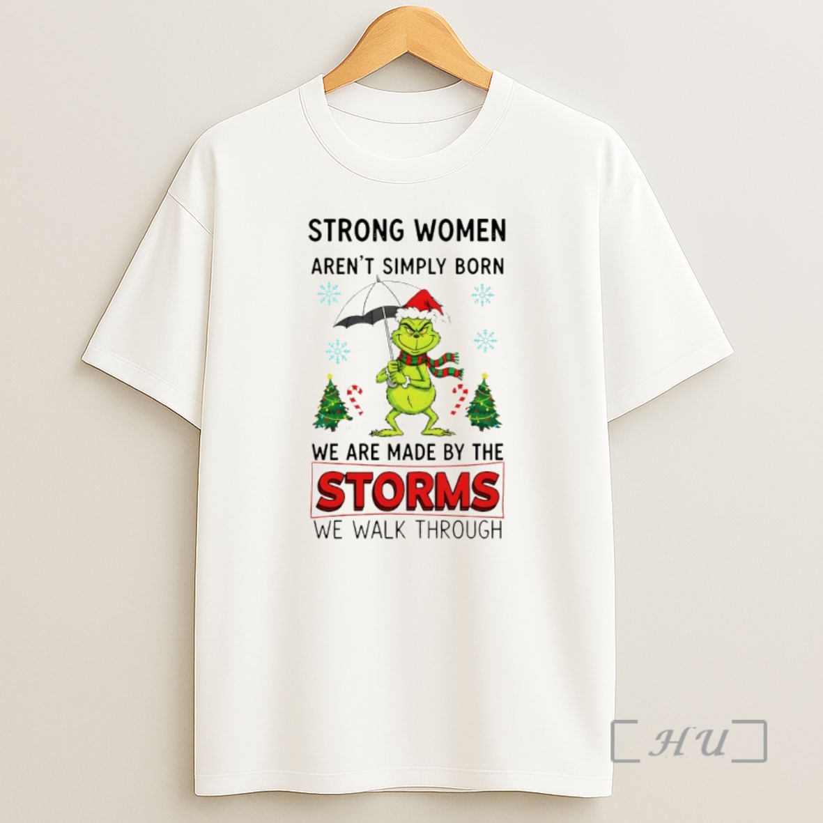 Officials Grinch Santa Hat Strong Women Arent Simply Born We Are Made By The Storms We Walk Through Merry Christmas Premium Shirt Sweatshirt Tee