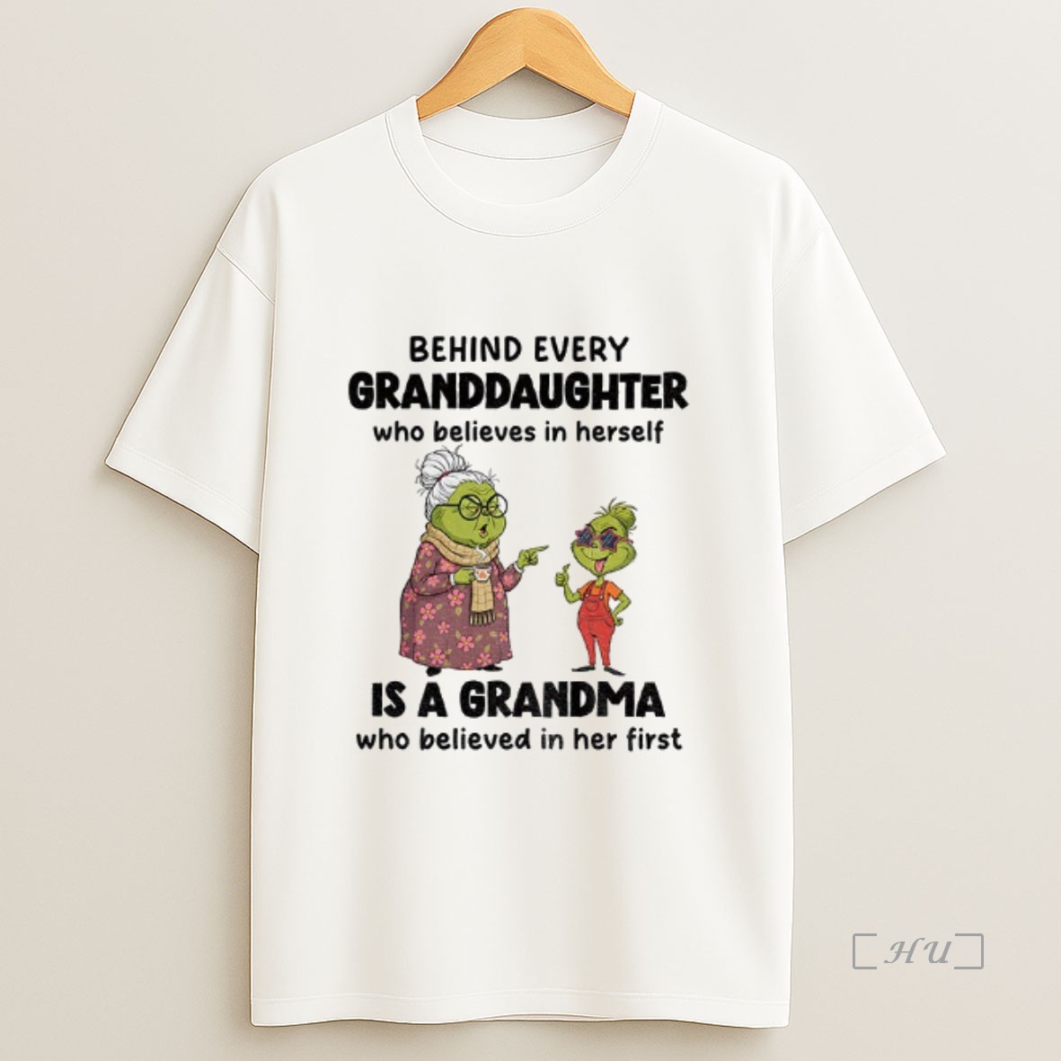 Officials Grinch Behind Every Granddaughter Who Believes In Herself Is A Grandma Who Believed In Her First Christmas Premium Shirt Sweatshirt Tee