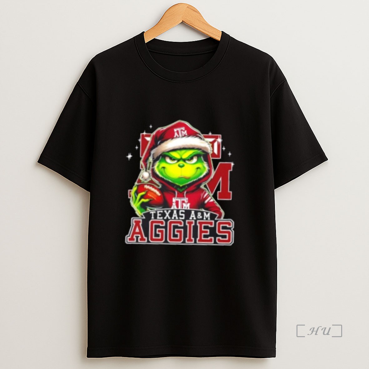 Officials Grinch Is Holding A Ball And Smiling At Texas Am Aggies Fans Christmas Premium Shirt Sweatshirt Tee