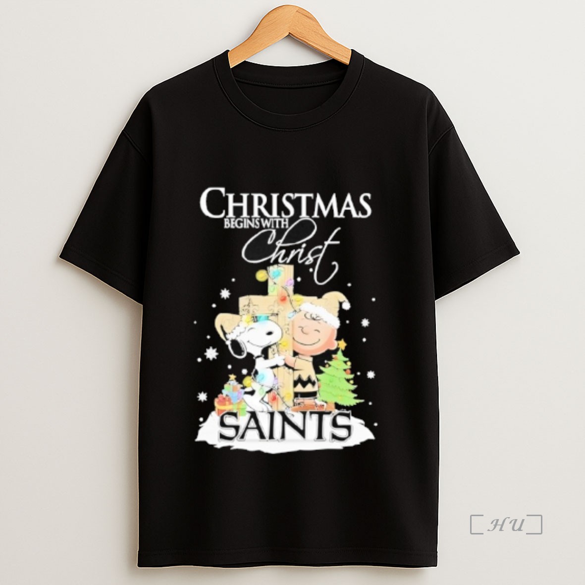 Officials Snoopy And Charlie Brown The Peanuts X New Orleans Saints Merry Christmas Begins With Christ Premium Shirt Sweatshirt Tee