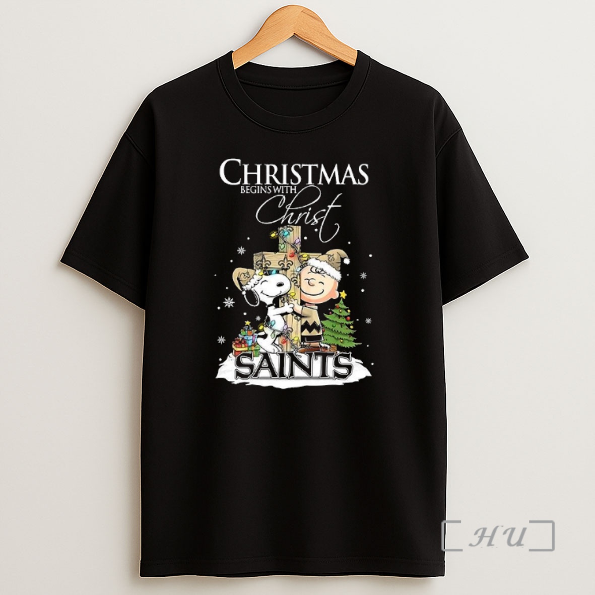 Officials Snoopy And Charlie Brown X New Orleans Saints Christmas Begins With Christ Cross Premium Shirt Sweatshirt Tee