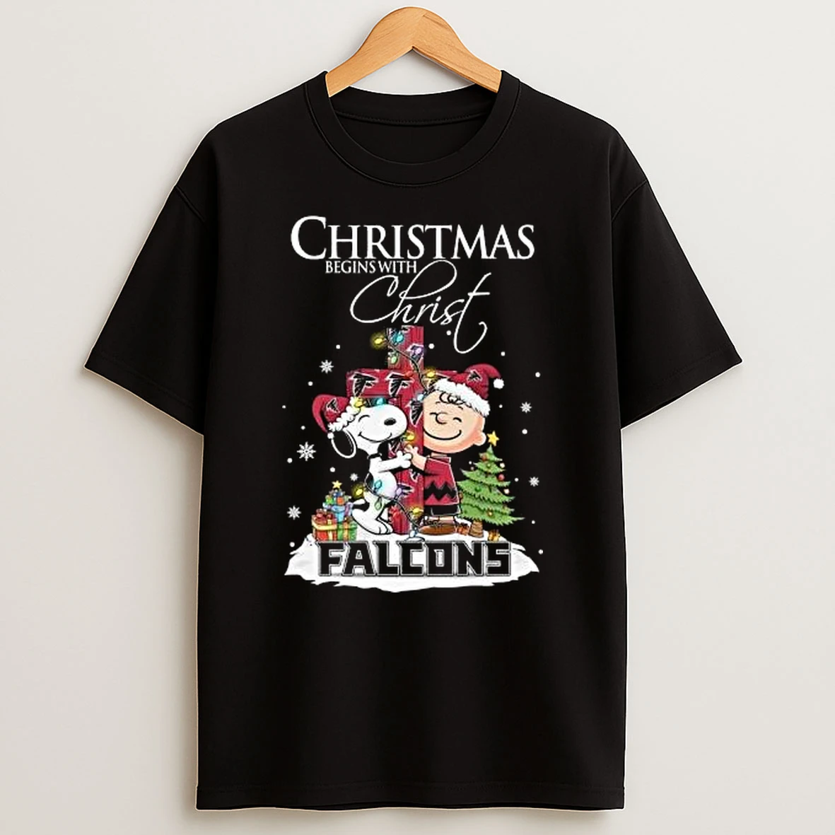 Snoopy And Charlie Brown X Atlanta Falcons Christmas Begins With Christ 2025 Shirts