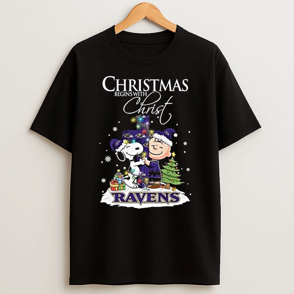 Snoopy And Charlie Brown X Baltimore Ravens Christmas Begins With Christ 2025 Shirts