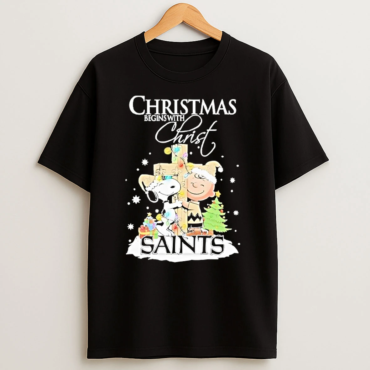 Snoopy And Charlie Brown The Peanuts X New Orleans Saints Merry Christmas Begins With Christ Shirts