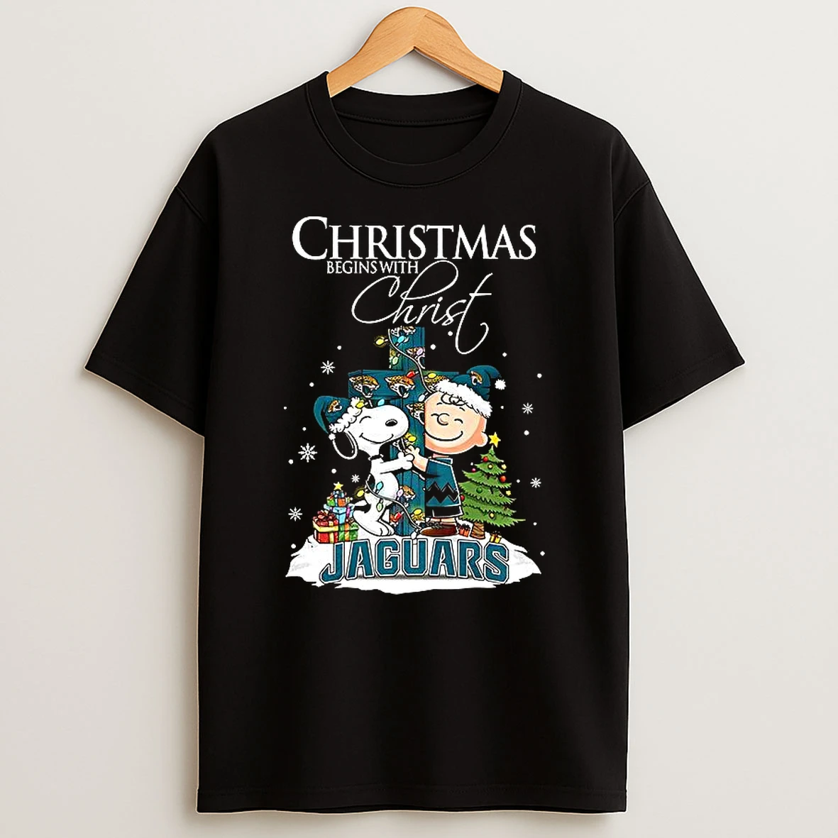 Snoopy And Charlie Brown X Jacksonville Jaguars Christmas Begins With Christ Cross Shirts