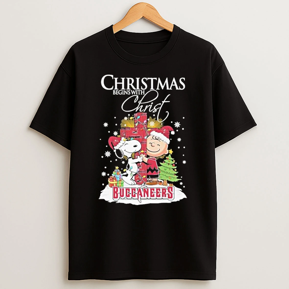 The Peanuts X Tampa Bay Buccaneers Christmas Begins With Christ Shirts