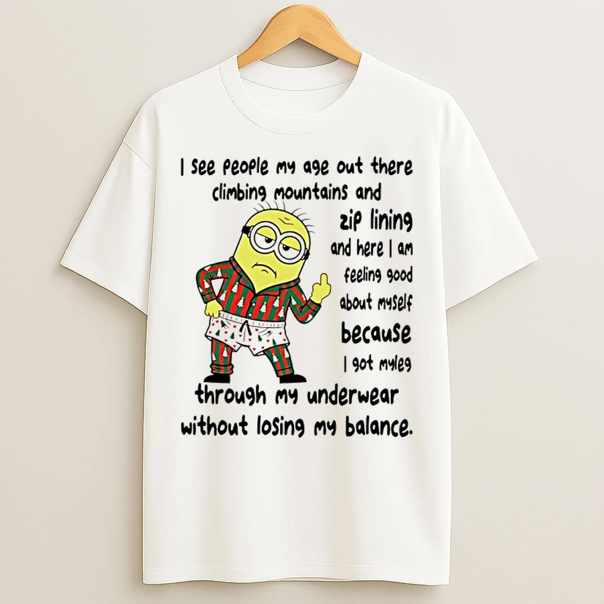 Classic Minion I See People My Age Out There Climbing Mountains And Zip Lining And Here I Am Feeling Good T Shirts